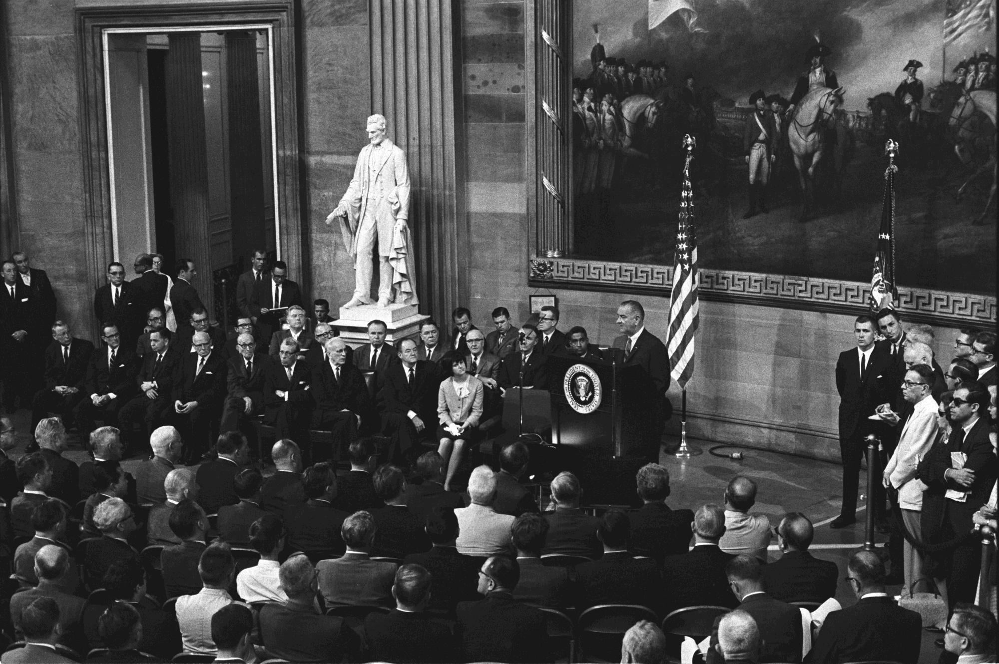 President Lyndon B. Johnson gives remarks inside the U.S. Capitol rotunda before signing the Voting Rights Act.