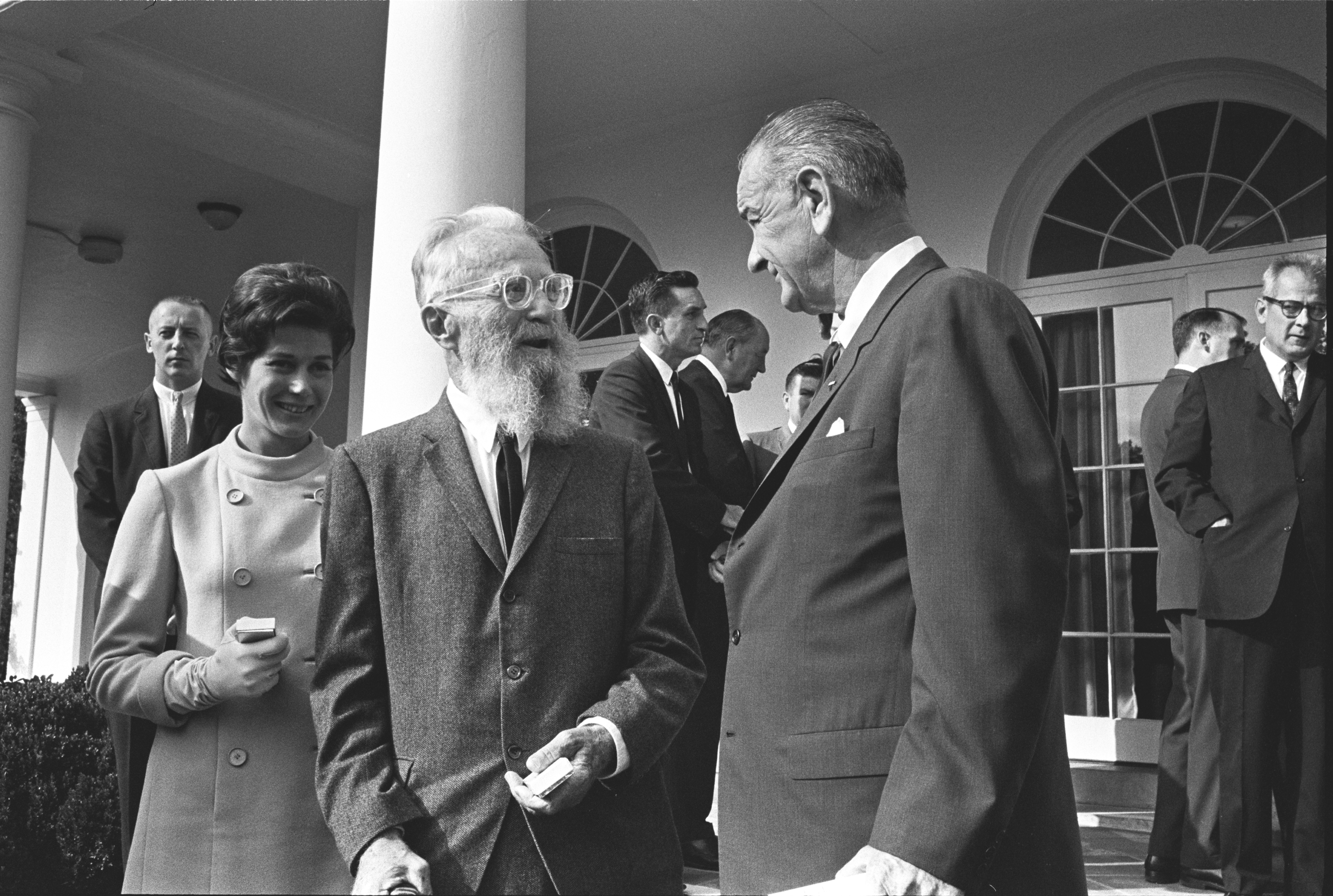 President Lyndon B. Johnson, Edward Steichen (photographer, painter, and art gallery and museum curator), and Mrs. Steichen speaking after the bill signing.