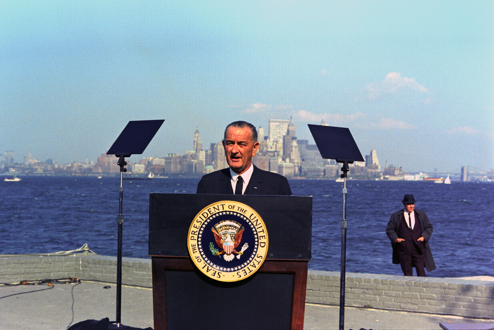 President Lyndon B. Johnson speaking from the podium at the bill signing.