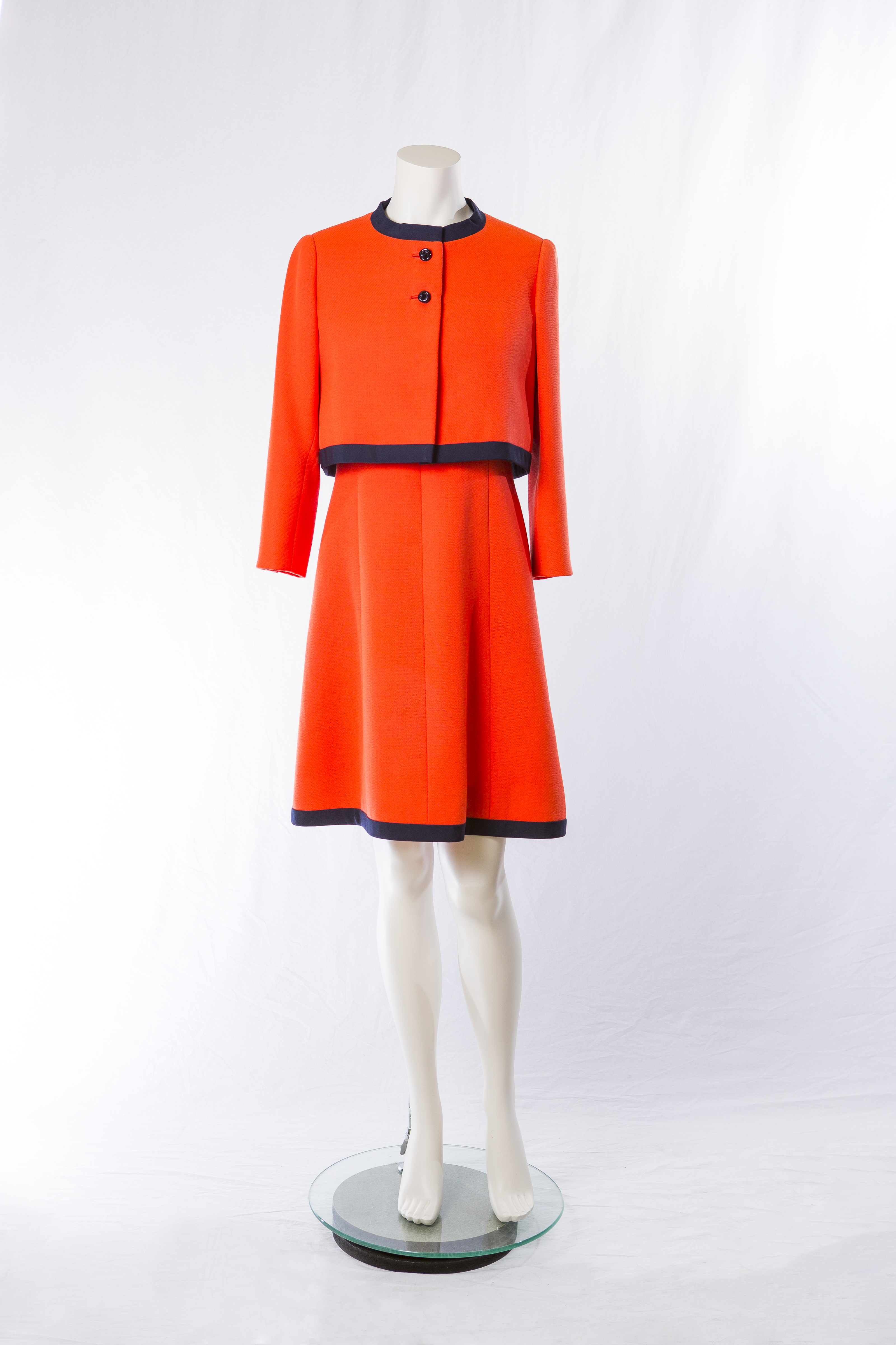 Red-orange sheath dress with matching jacket by Adele Simpson