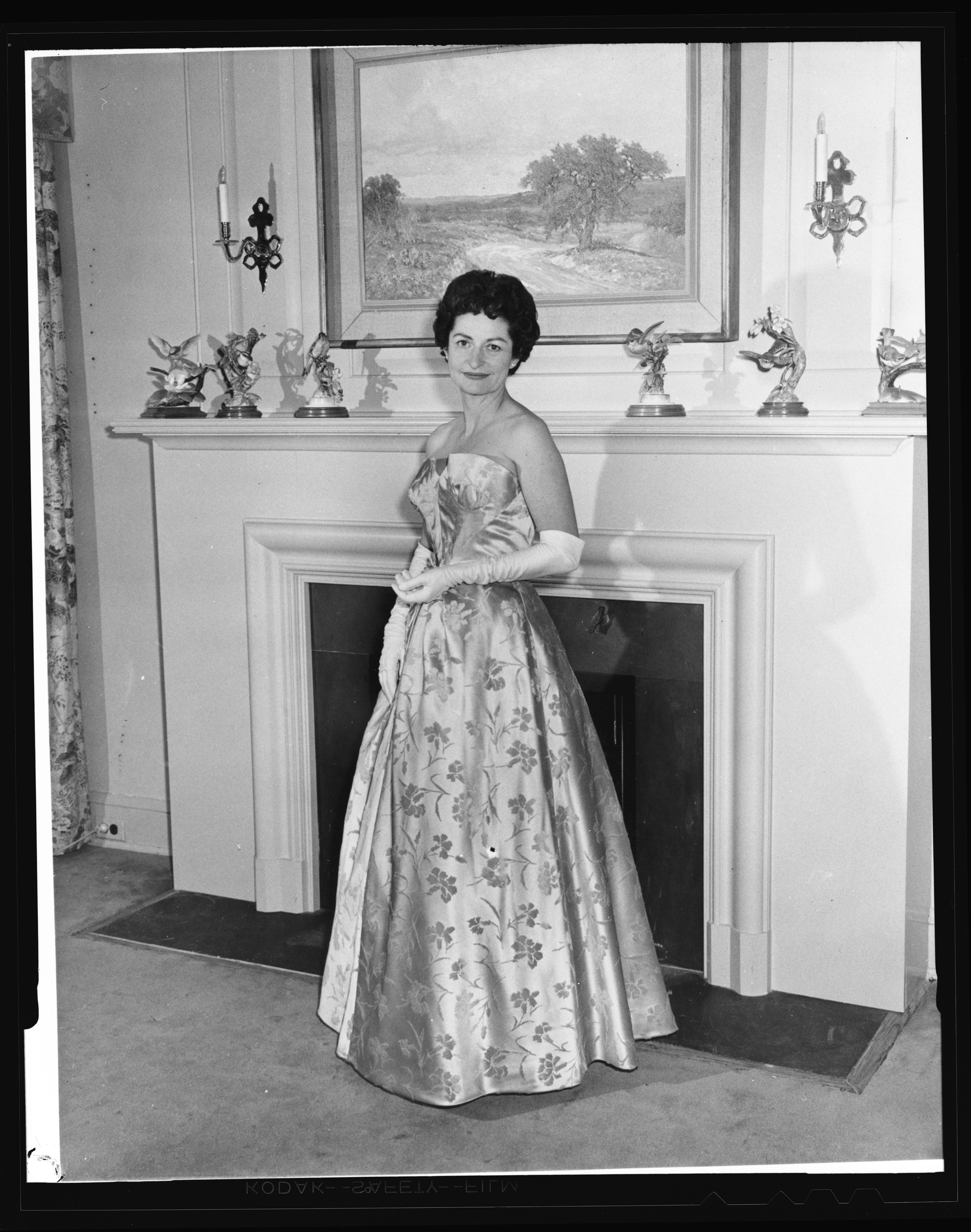 Lady Bird Johnson poses in the formal gown she wore to the 1961 inaugural ball.