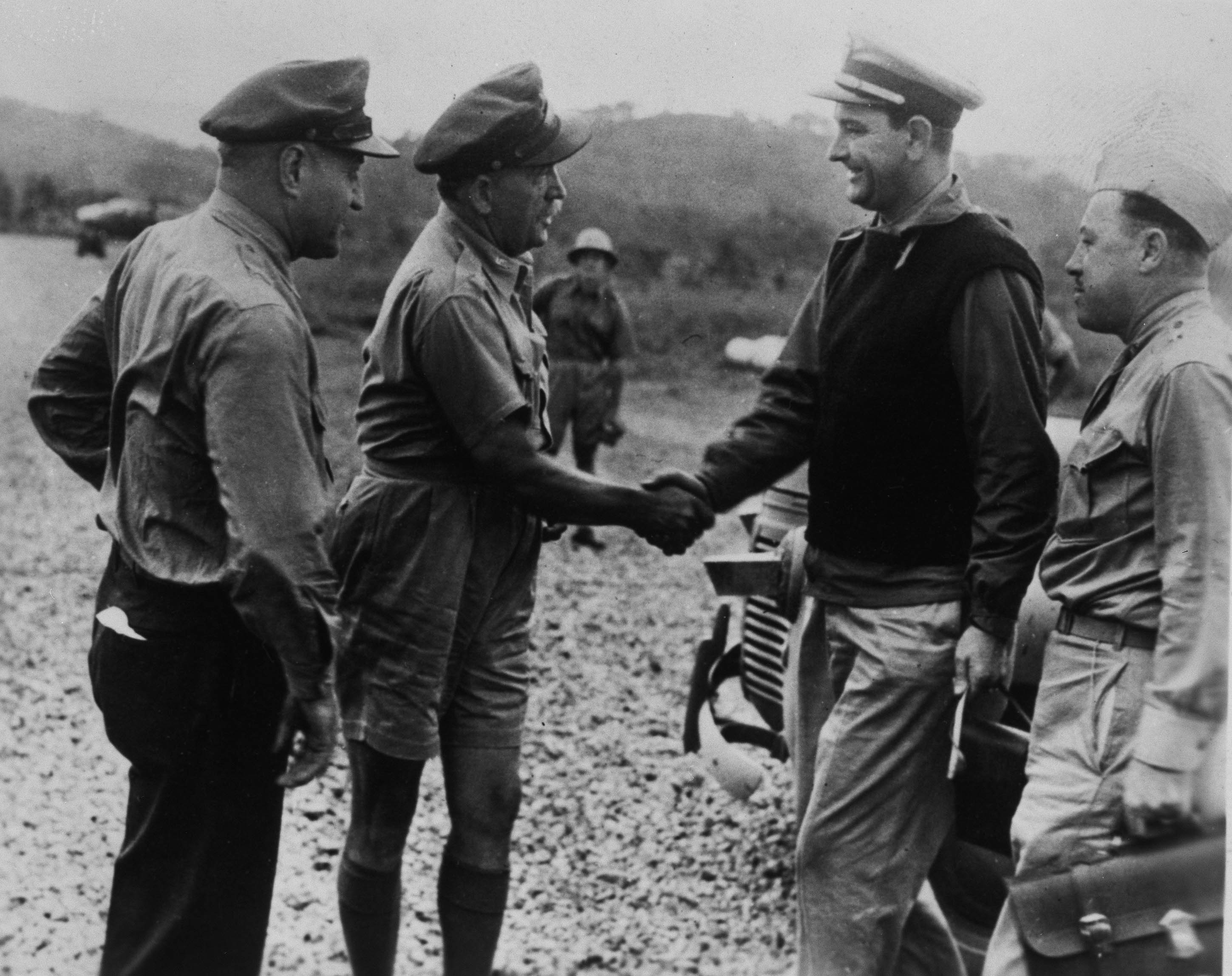 Gen. Ralph Royce and Brig. General Martin F. Scanlon greet Lt. Commander Lyndon B. Johnson upon his arrival at Seven-Mile Air Drome near Port Moresby, New Guinea, on June 9.