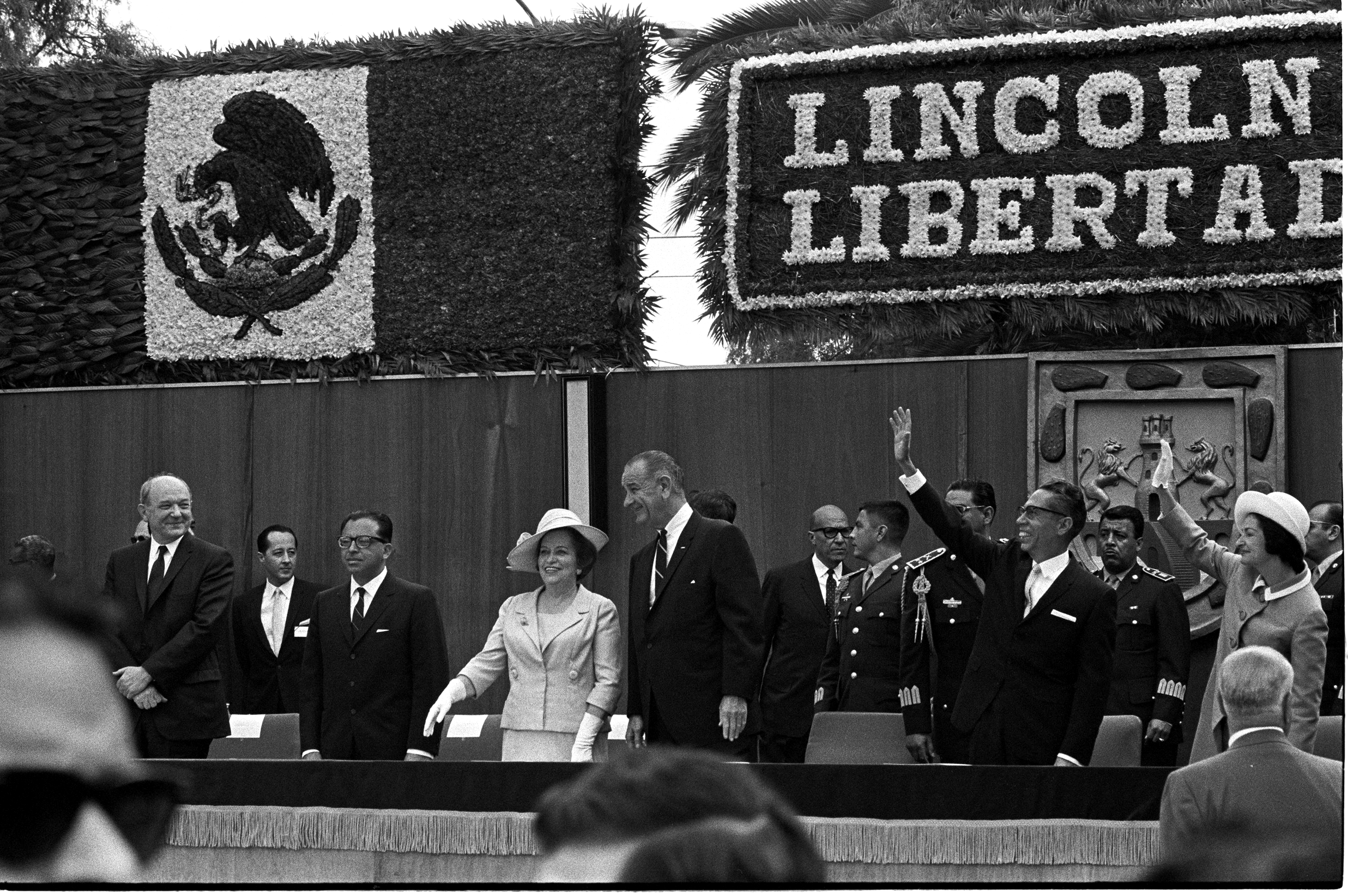 Front Row (L-R): Sec. Dean Rusk, unknown, unknown, Guadalupe Borja de Diaz Ordaz, Pres. Lyndon Baines Johnson, Pres. Gustavo Diaz Ordaz (Mexico), and Lady Bird Johnson. Back rows: Unknown. LBJ Library photo by Yoichi Okiamoto #A2264-21.