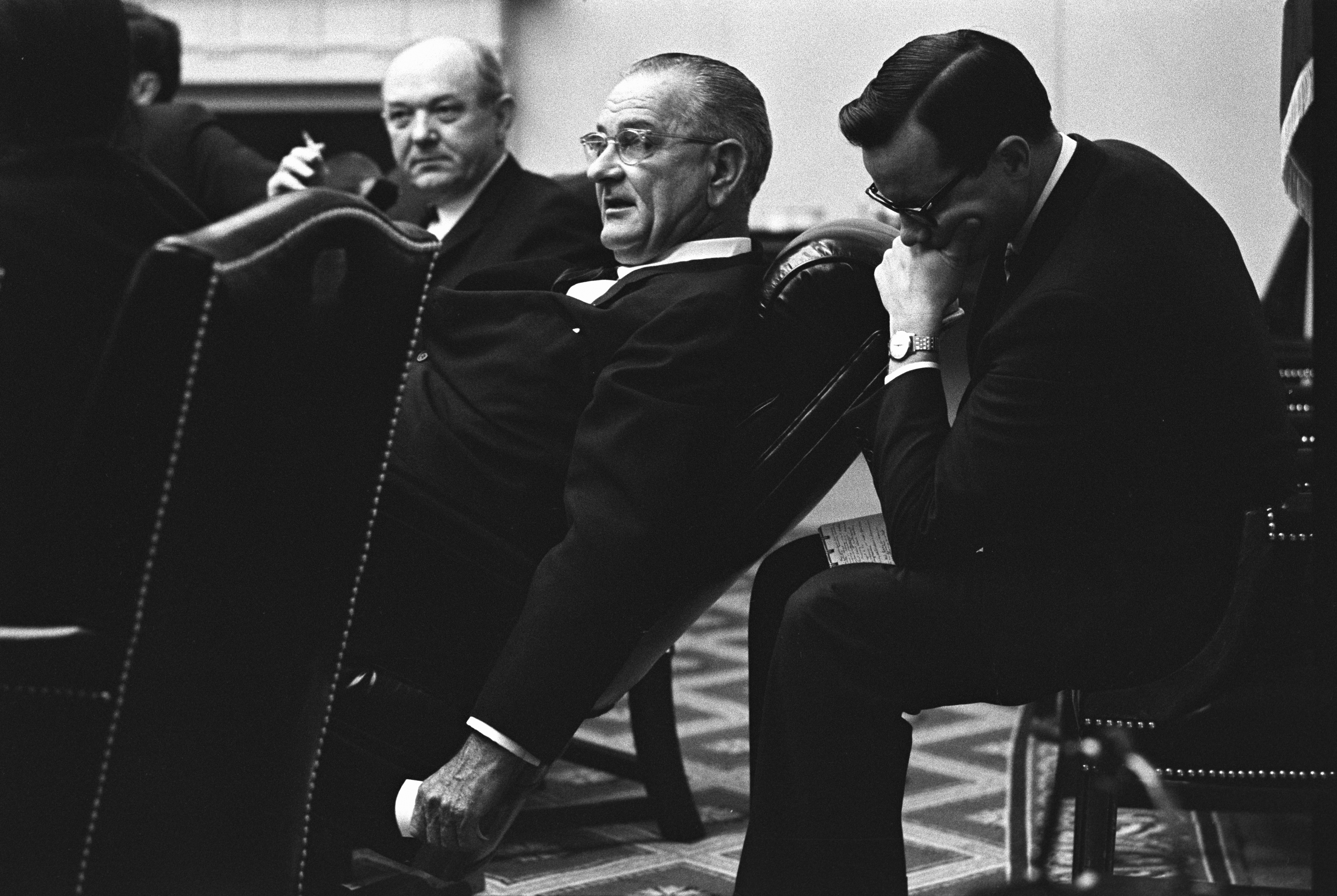 (L-R:) Sec. Dean Rusk, President Lyndon B. Johnson, Bill Moyers