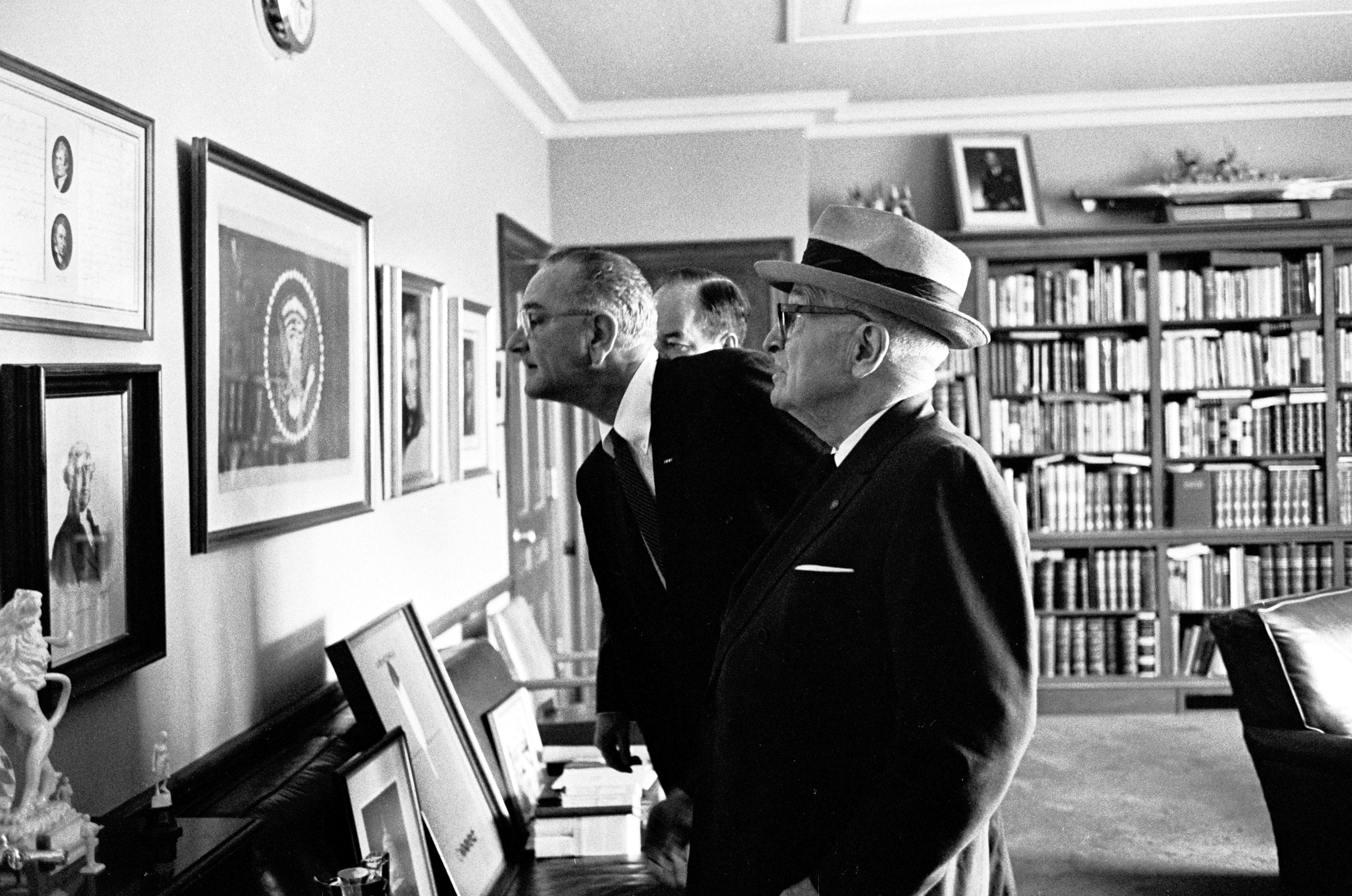 Former President Harry S. Truman give President Lyndon B. Johnson and Vice President Hubert Humphrey a tour of offices at the Library. LBJ Library photo by Jay Godwin #A985-20A.