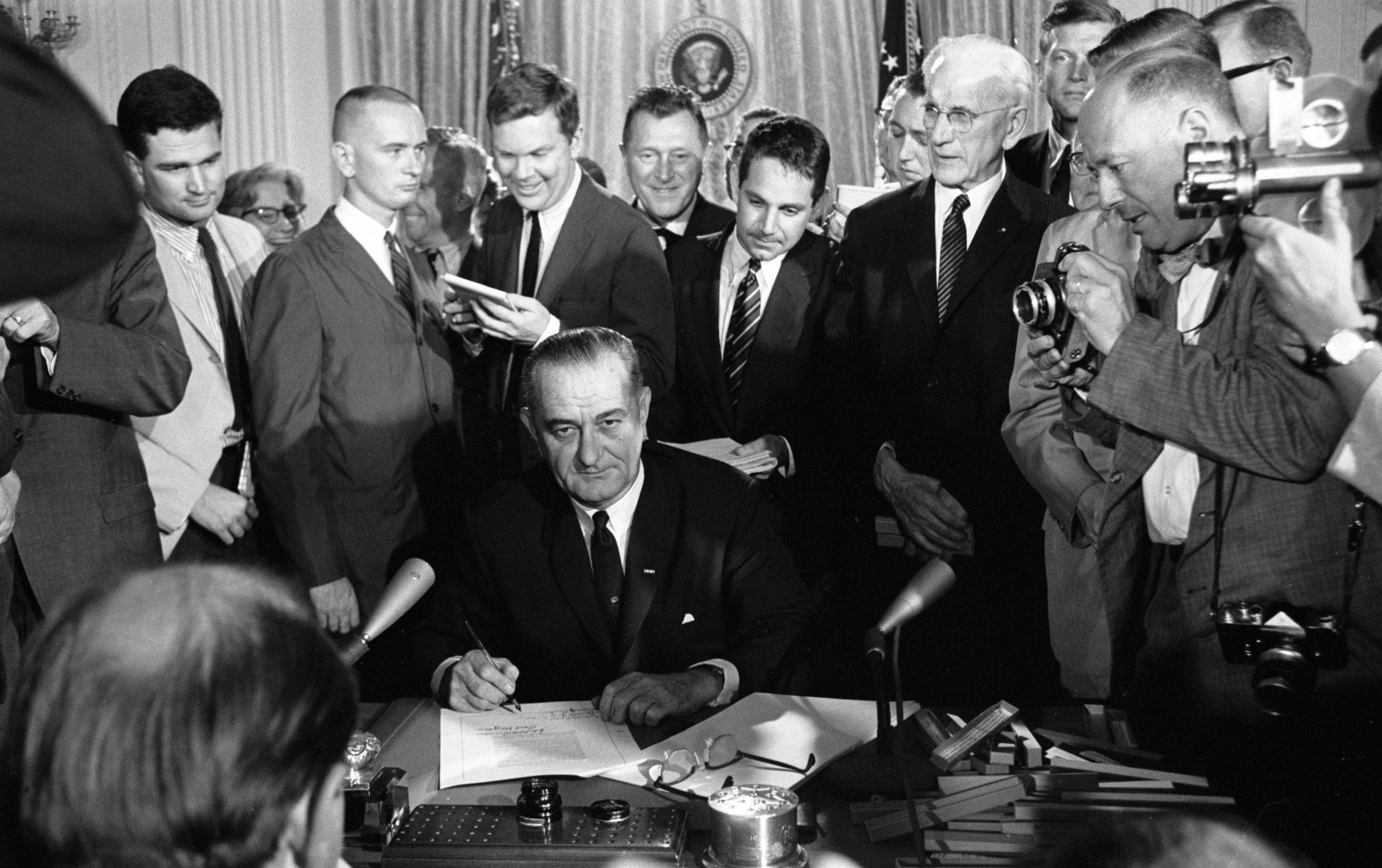 Signing of the Civil Rights Act of 1964. LBJ Library photo by Cecil Stoughton #276-28-WH64.