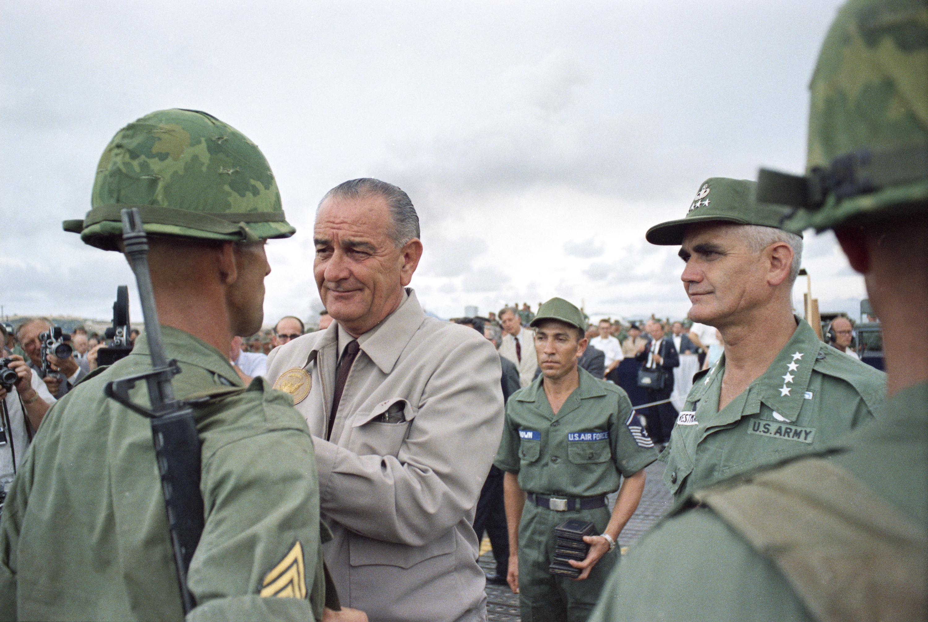 President Johnson decorates a soldier as Gen. William Westmoreland (right), other soldiers, press look on. LBJ Library photo by Yoichi Okamoto #C3599-31.