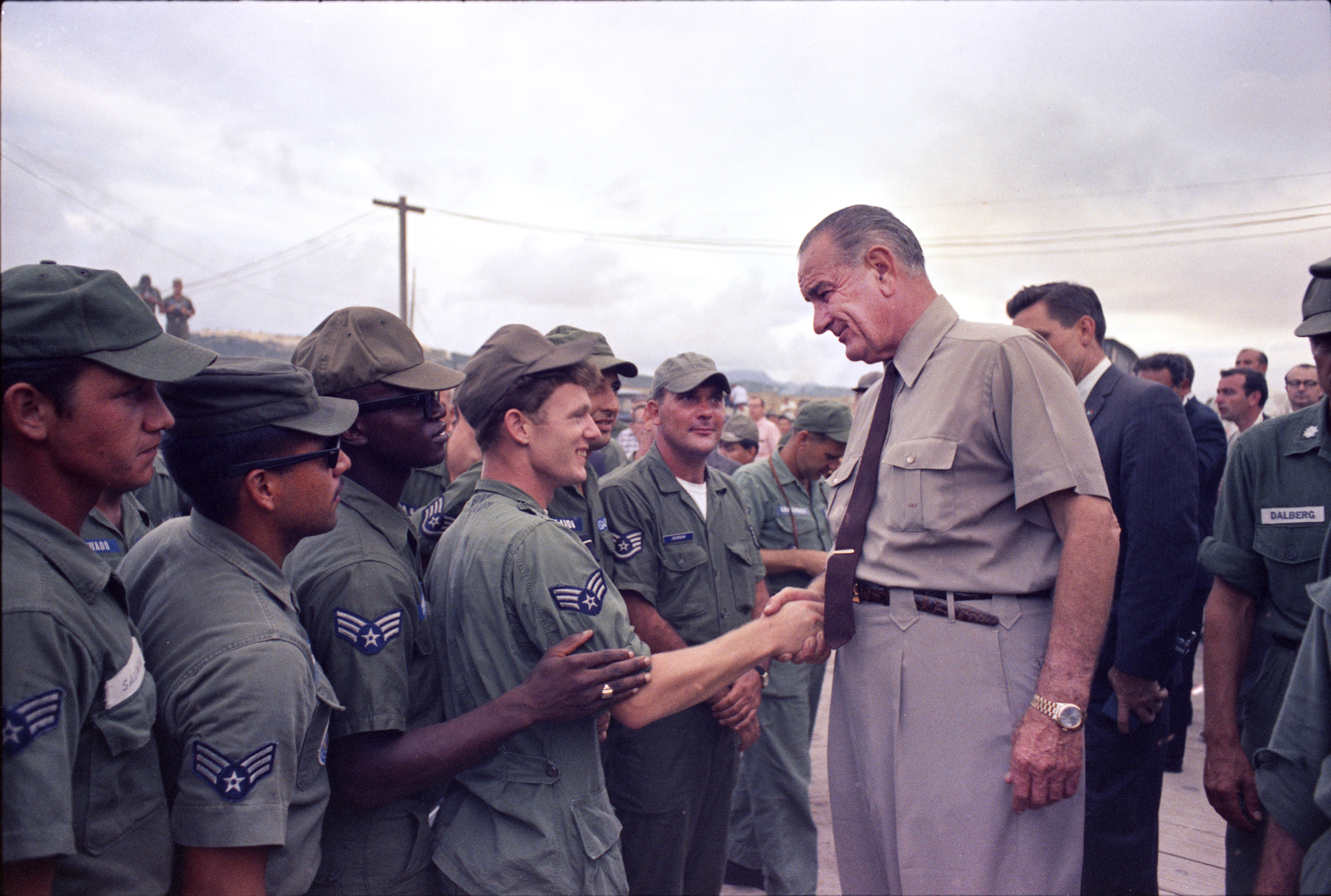 President Johnson shakes hands with U.S. soldiers. LBJ Library photo by Yoichi Okamoto #C3600-8.