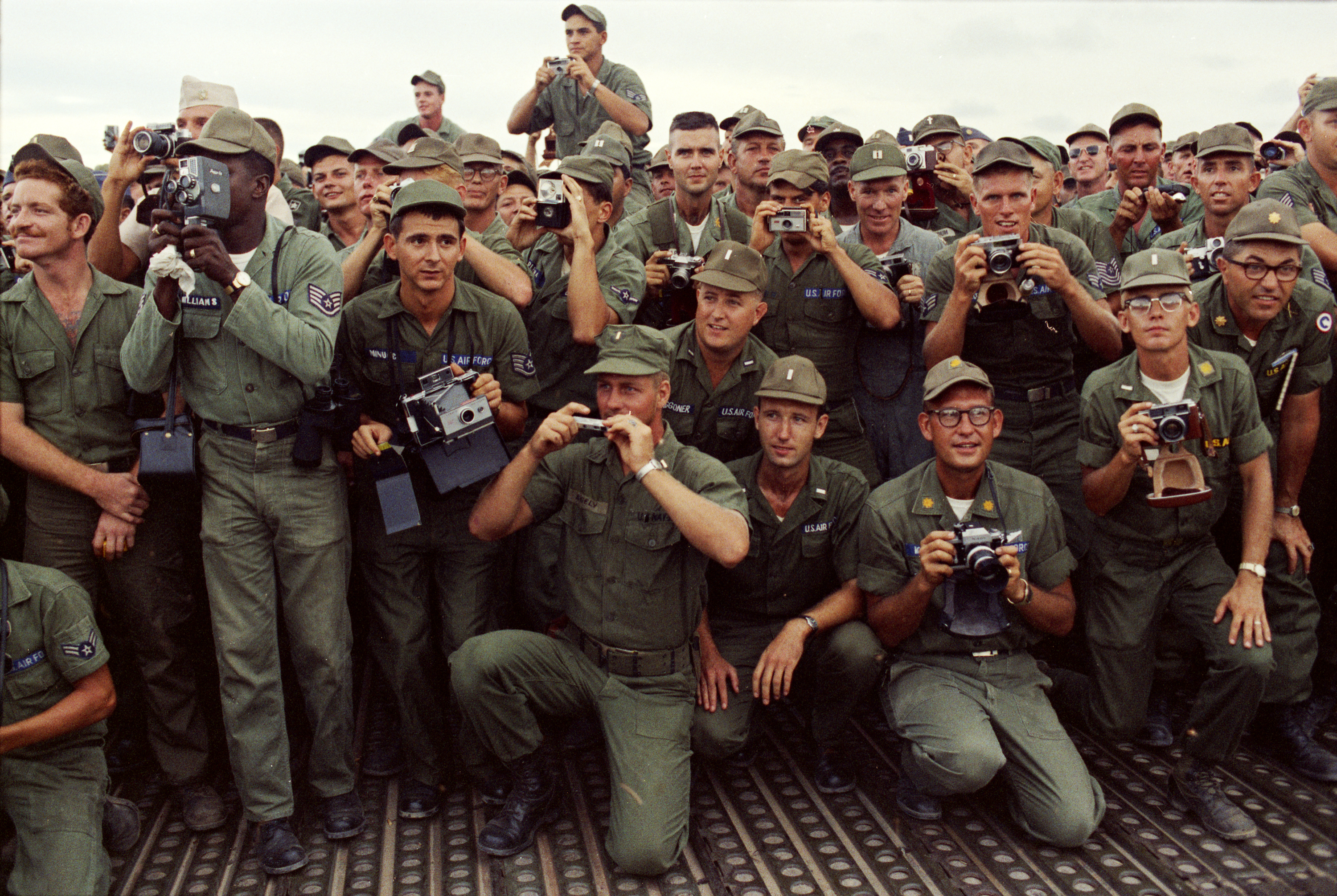 U.S. soldiers take photos of President Johnson during his visit to Cam Ranh Bay. LBJ Library photo by Yoichi Okamoto #C3602-7.