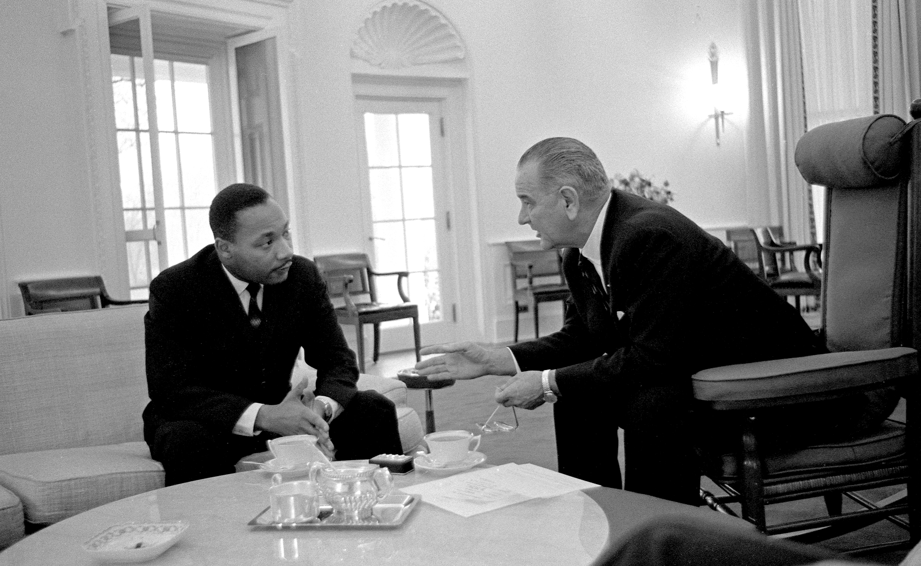 (L-R) Martin Luther King, Jr. talks with President Lyndon B. Johnson. LBJ Library photo by Yoichi Okamoto #W28-12.