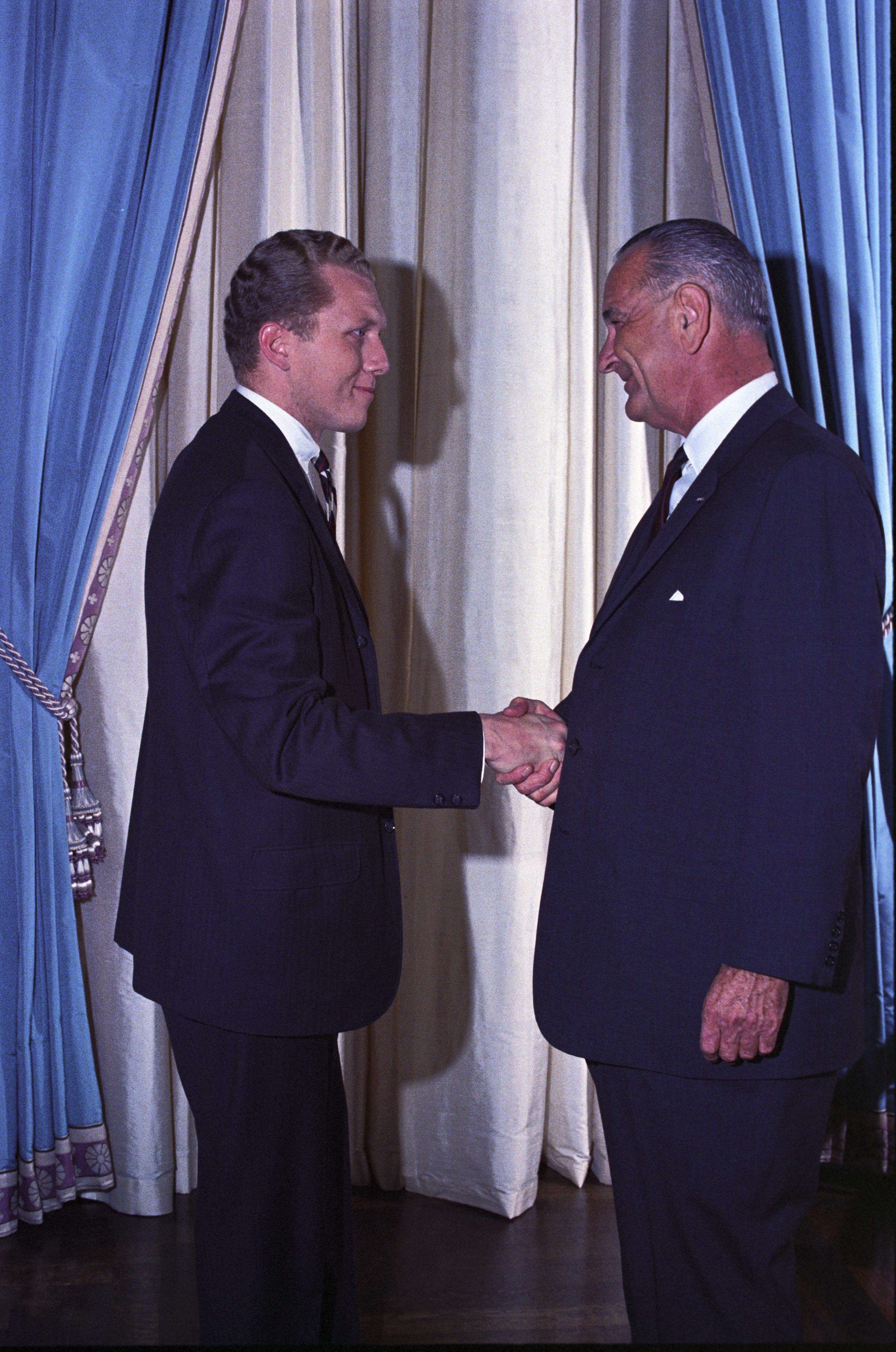 President Johnson shakes hands with Robert Hardesty.