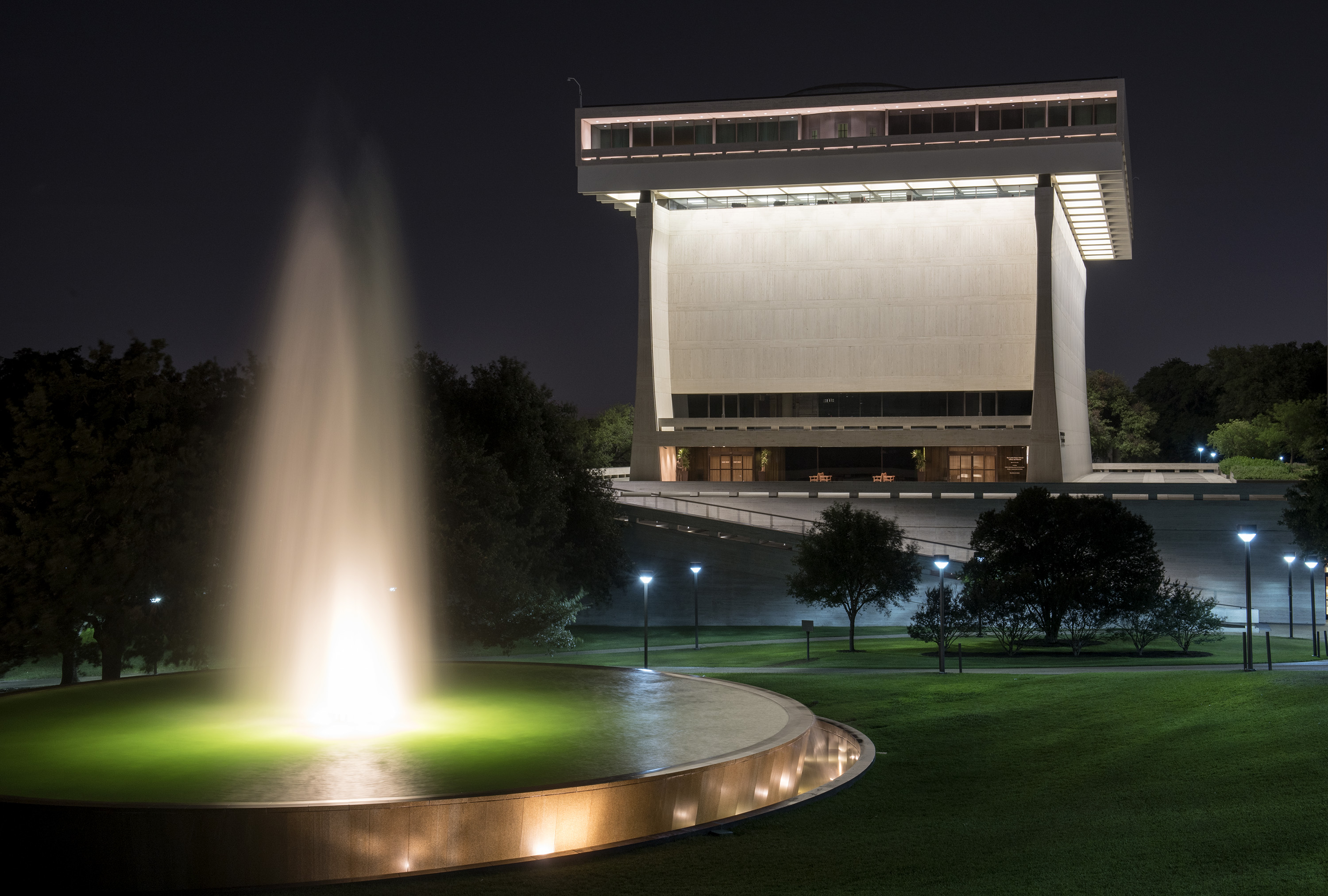 The fountain and LBJ Presidential Library at night.