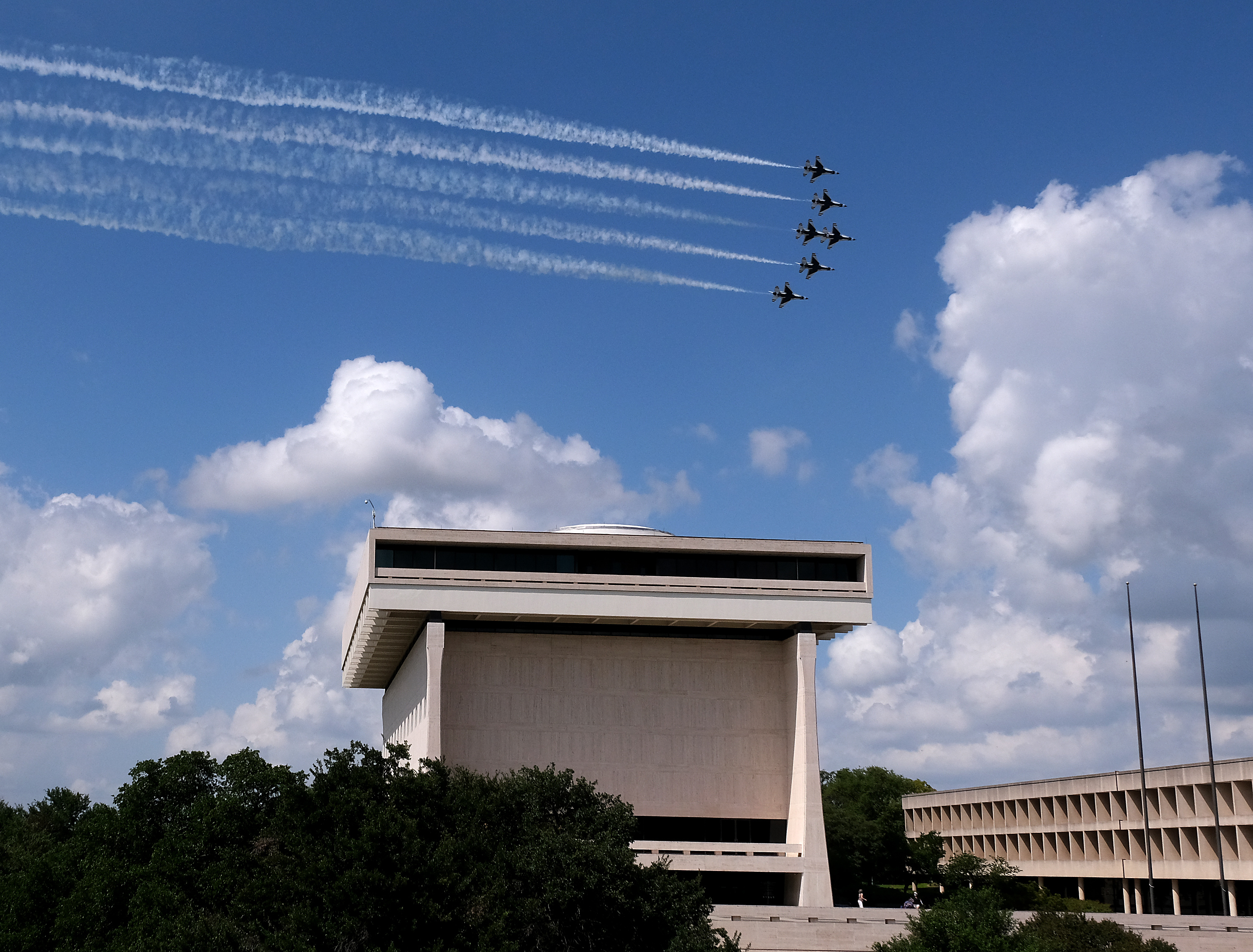 A formation of U.S. Air Force Thunderbirds flew over Austin on May 13, 2020, to honor frontline COVID-19 responders and essential workers. The jets made a turn behind the LBJ Library in the flight across the city.