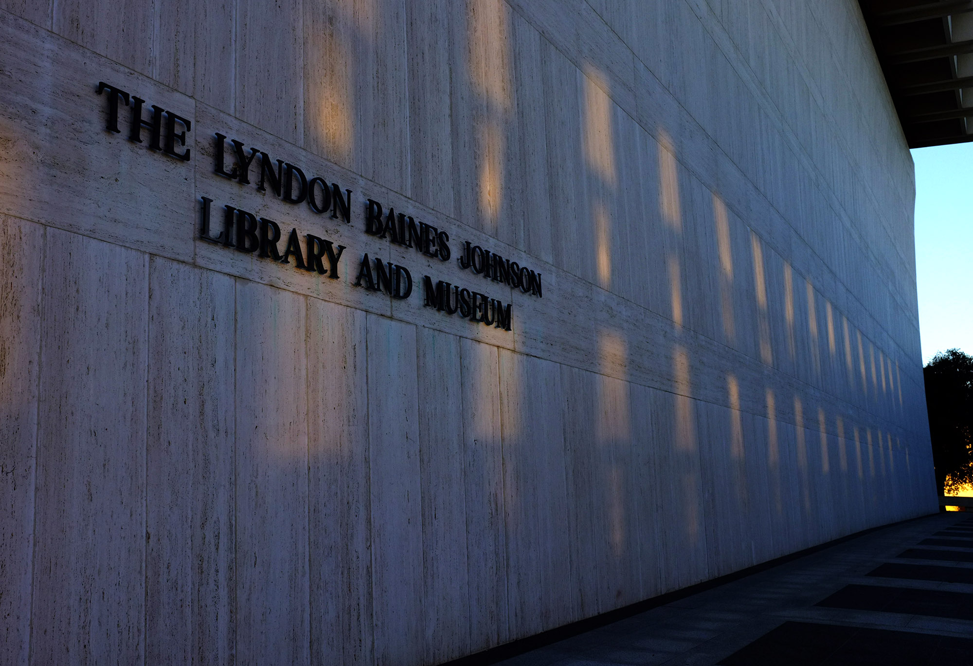 The LBJ Presidential Library with reflections at sunset from windows at the LBJ school next door.