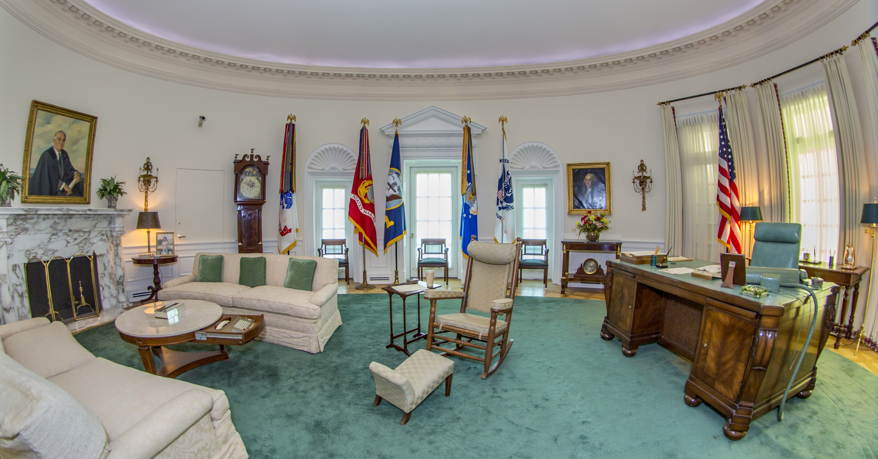 The Oval Office replica at the LBJ Presidential Library. This famous room from the West Wing of the White House has been reproduced in our library at a 7/8th scale. The Oval Office looks exactly as it did during LBJ's White House years, including the desk he used beginning in his Senate days through the White House years, rocking chair, telephone system, and the teletype machines and three televisions that kept him up to date on the news. Photo taken with a fisheye lens.