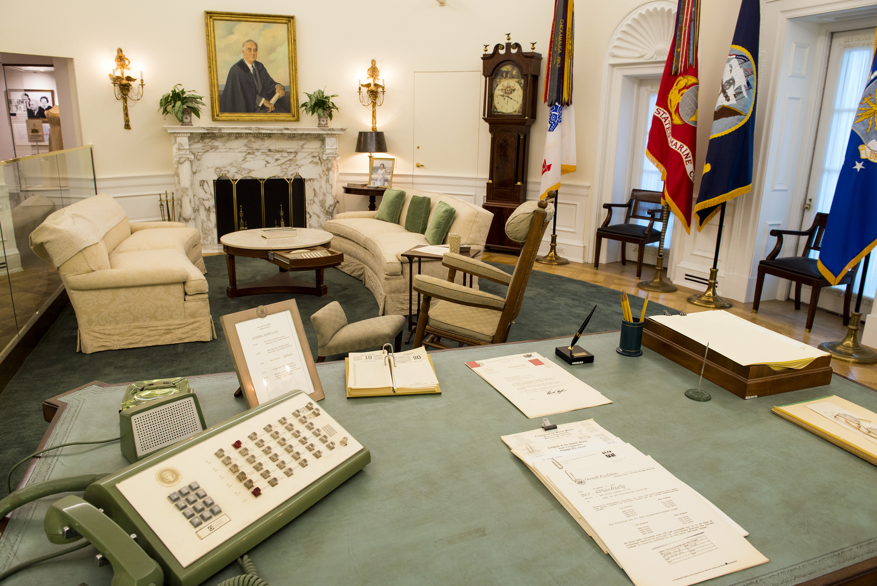 The Oval Office replica at the LBJ Presidential Library. This famous room from the West Wing of the White House has been reproduced in our library at a 7/8th scale. The Oval Office looks exactly as it did during LBJ's White House years, including the desk he used beginning in his Senate days through the White House years, rocking chair, telephone system, and the teletype machines and three televisions that kept him up to date on the news.