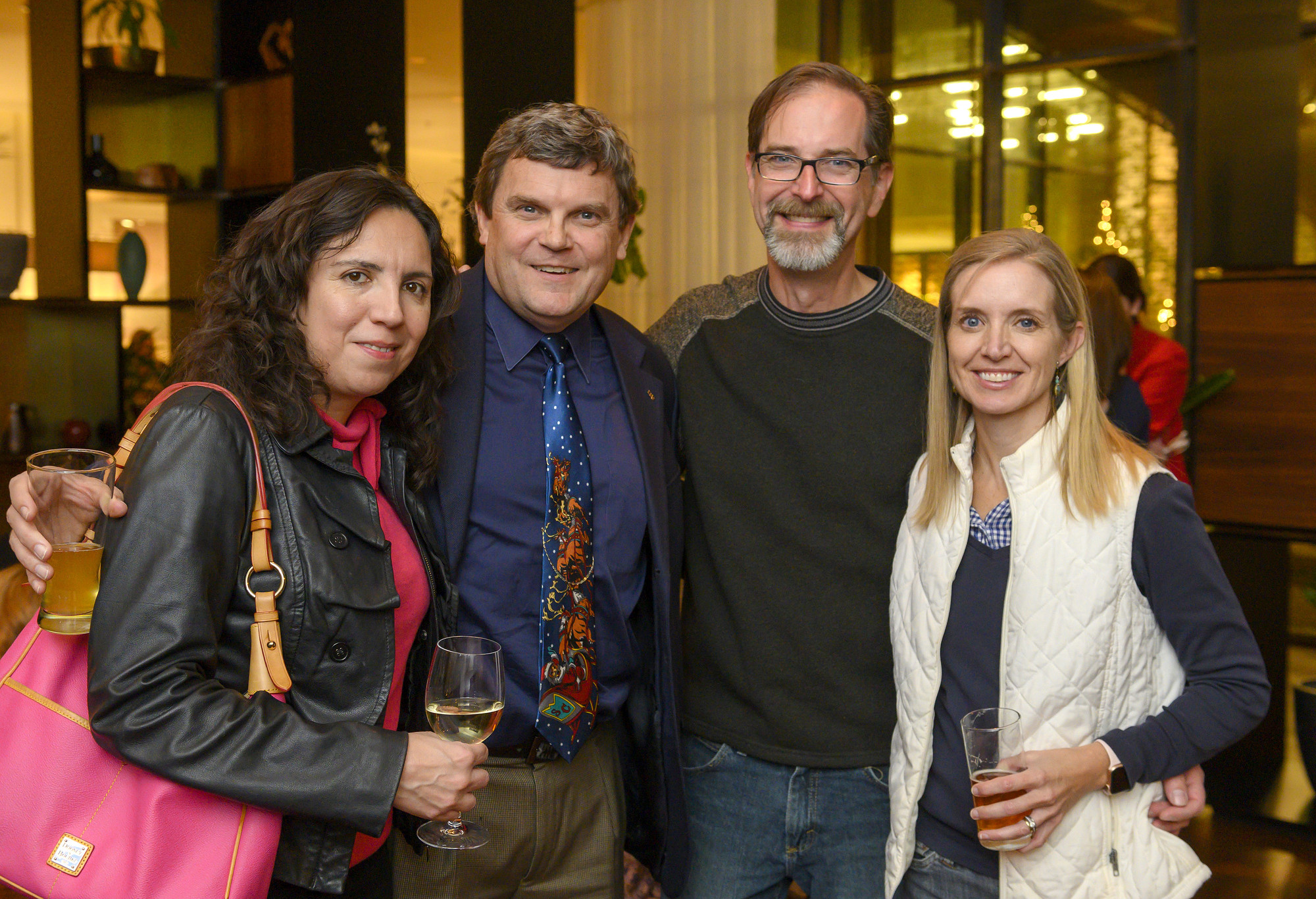 Christa Gomez, TJ Costello, Alan Fisher, and Susan Armstrong Fisher at the Future Forum Holiday Happy Hour at the South Congress Hotel