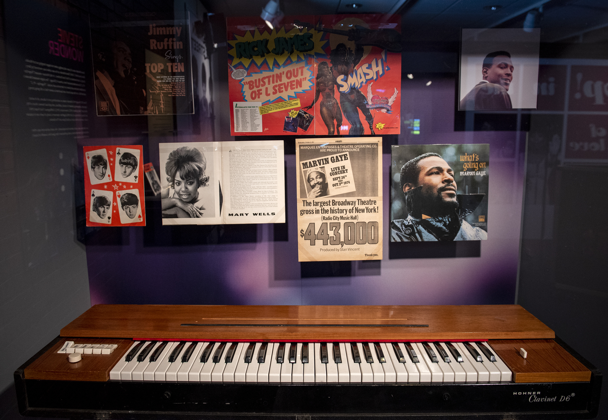 Below Motown album covers, a view of Stevie Wonder's keyboard on view in the exhibition.
