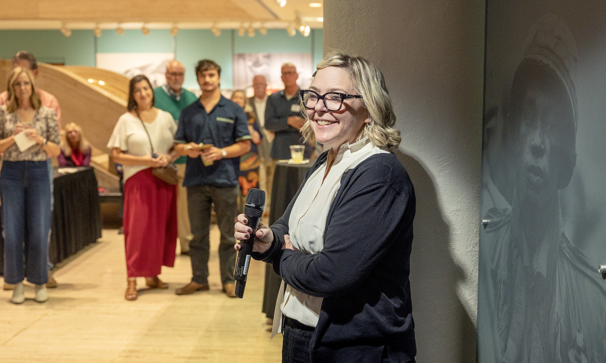 Lara Hall, LBJ Library museum curator, welcomed visitors to the exhibit