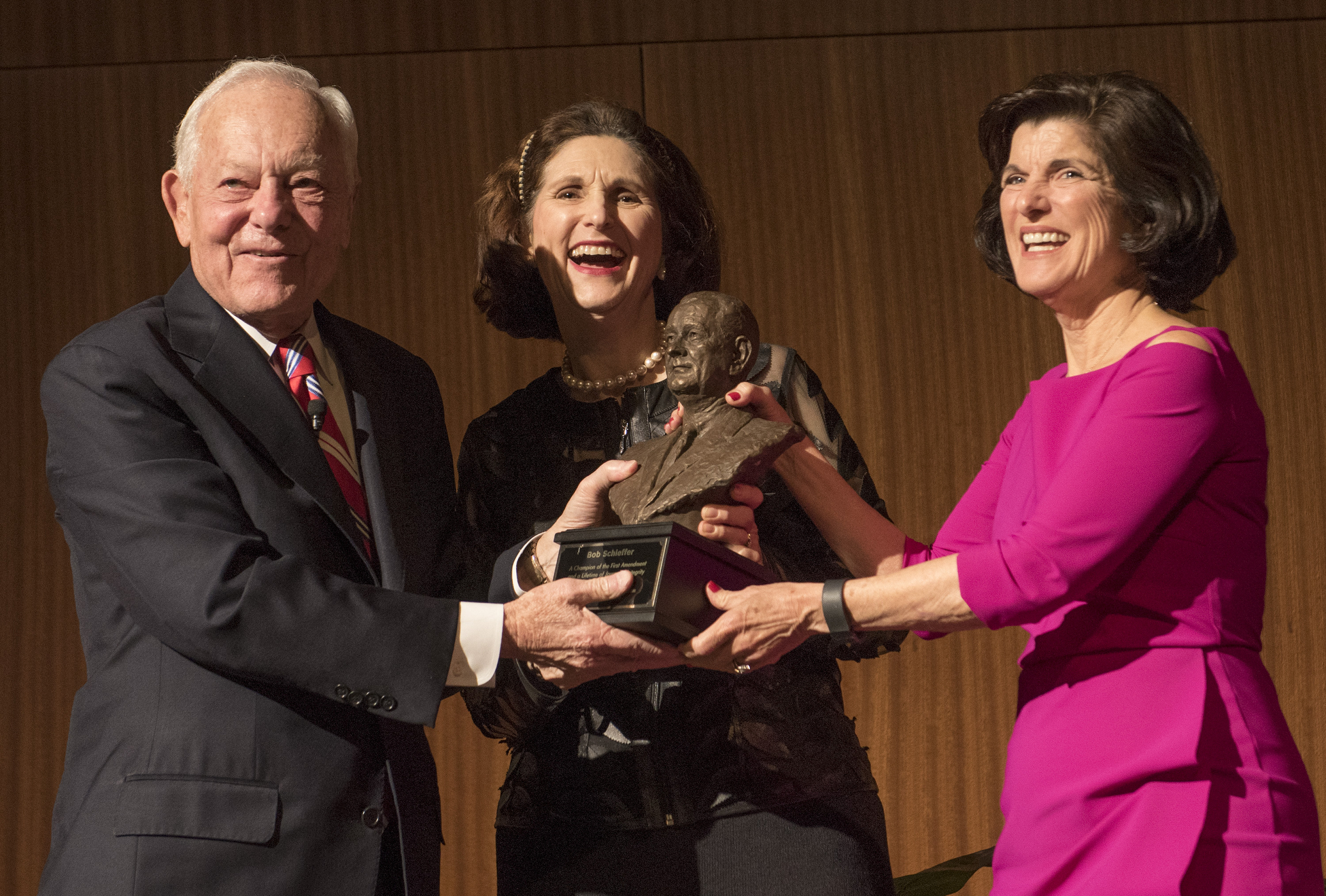 (L-R) Lynda Johnson Robb and Luci Baines Johnson present Bob Schieffer a bust of President Johnson.