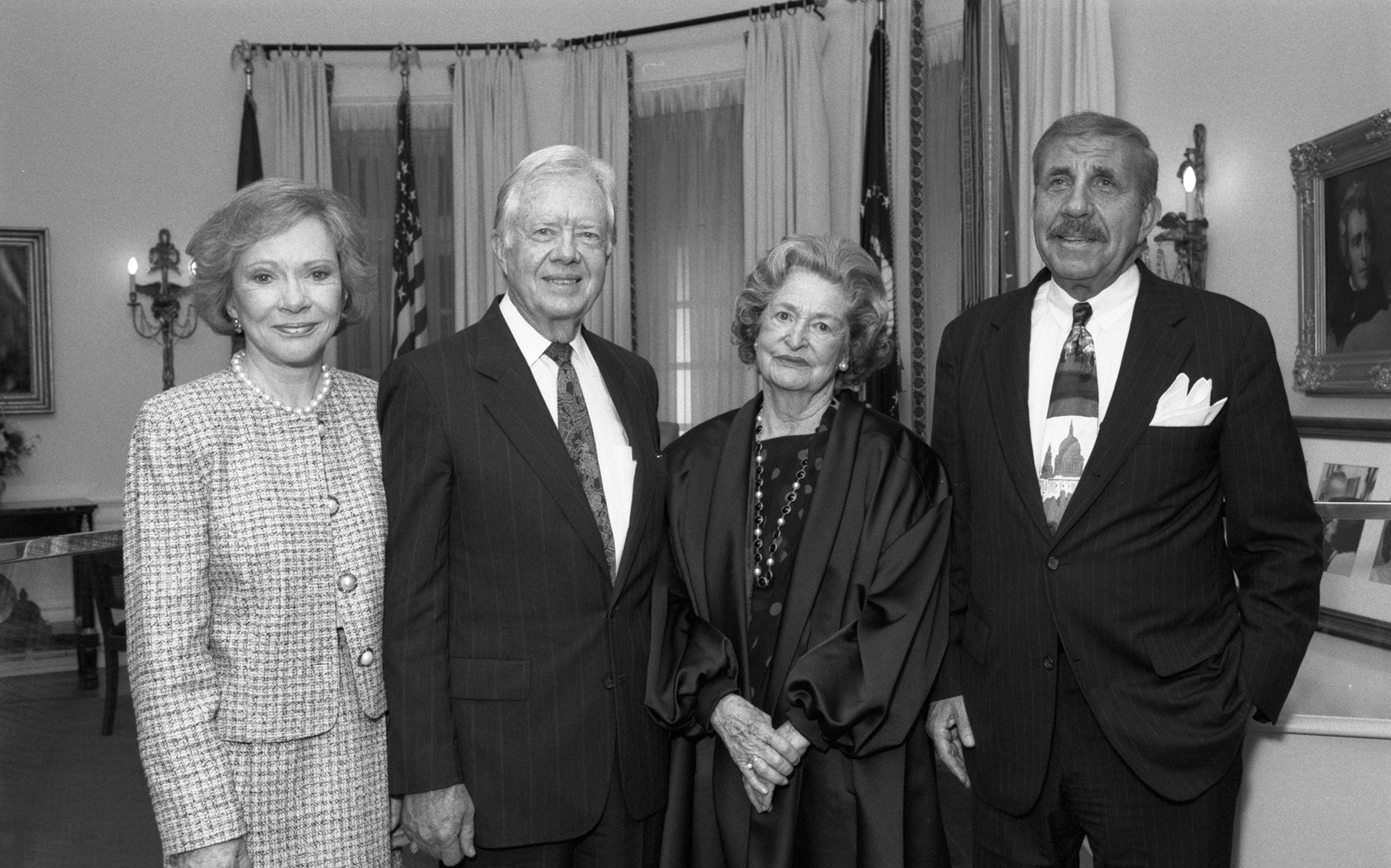 Rosalynn and Jimmy Carter, Lady Bird Johnson, and LBJ Library Director Harry Middleton in the Oval Office exhibition at the LBJ Library, March 6, 1995.