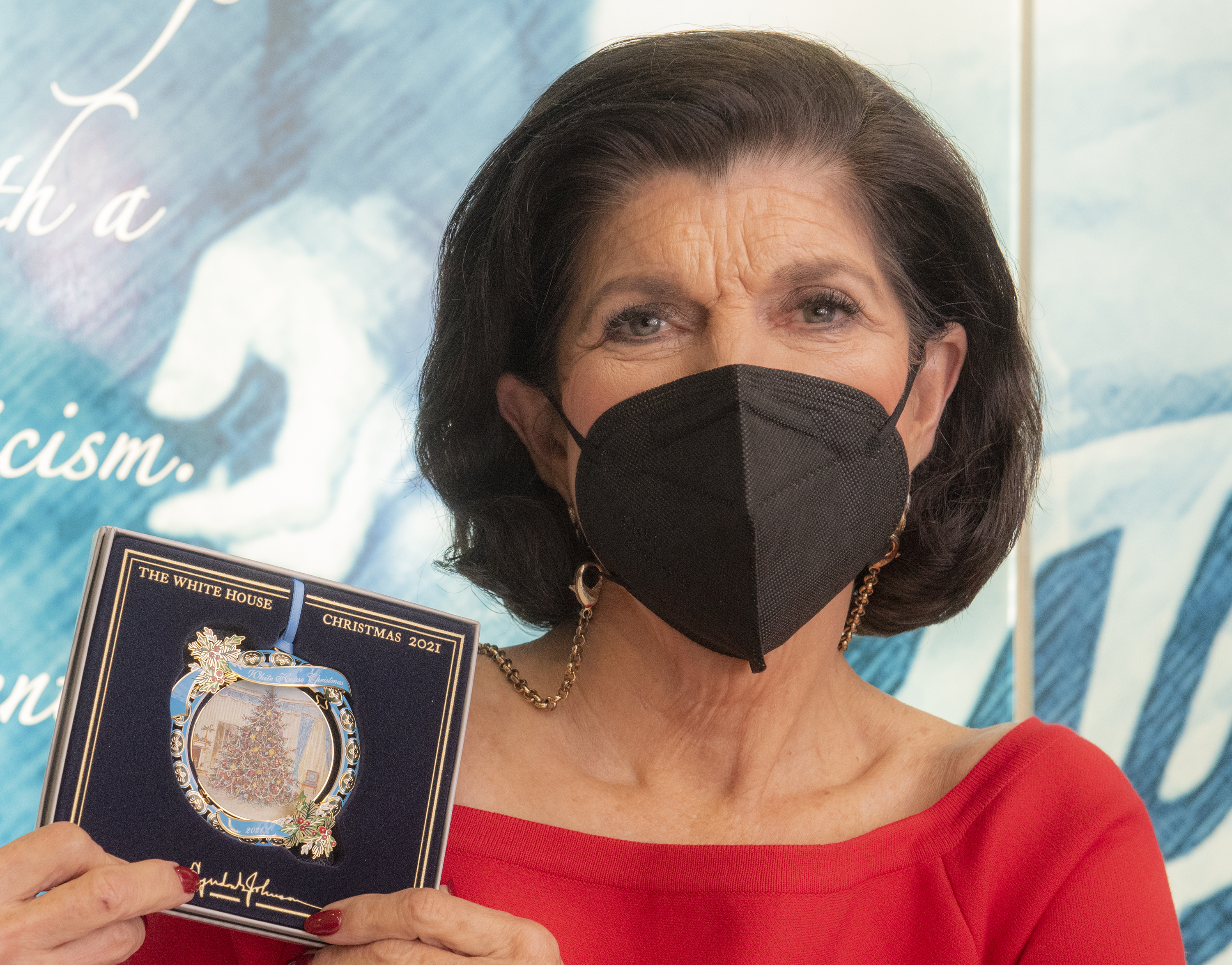 Luci Baines Johnson holds the 2021 White House Christmas Ornament.