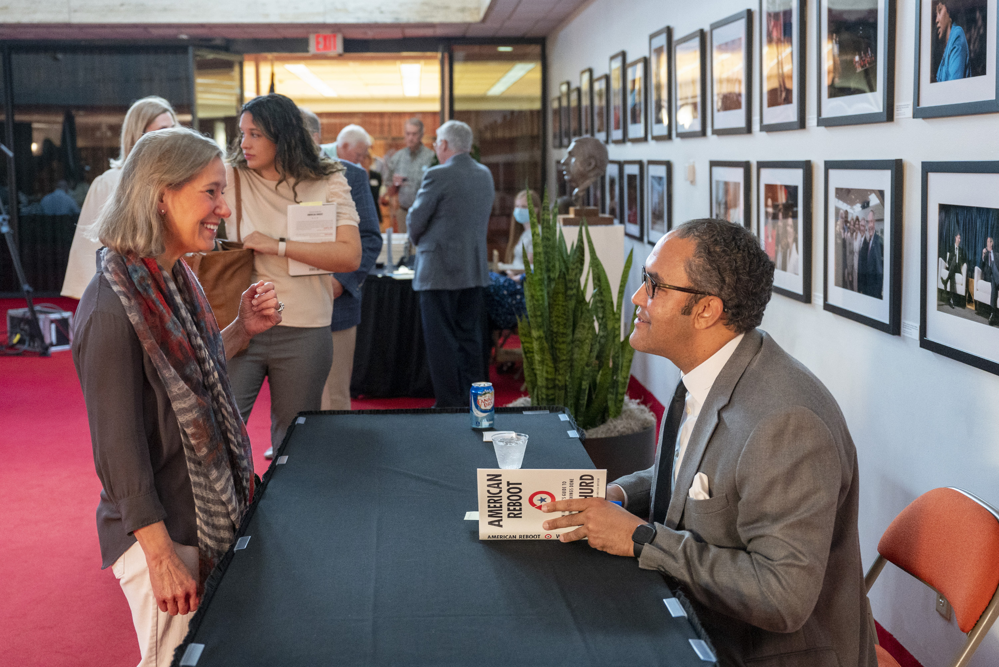 Will Hurd signs a book for Dorothy Marchand.