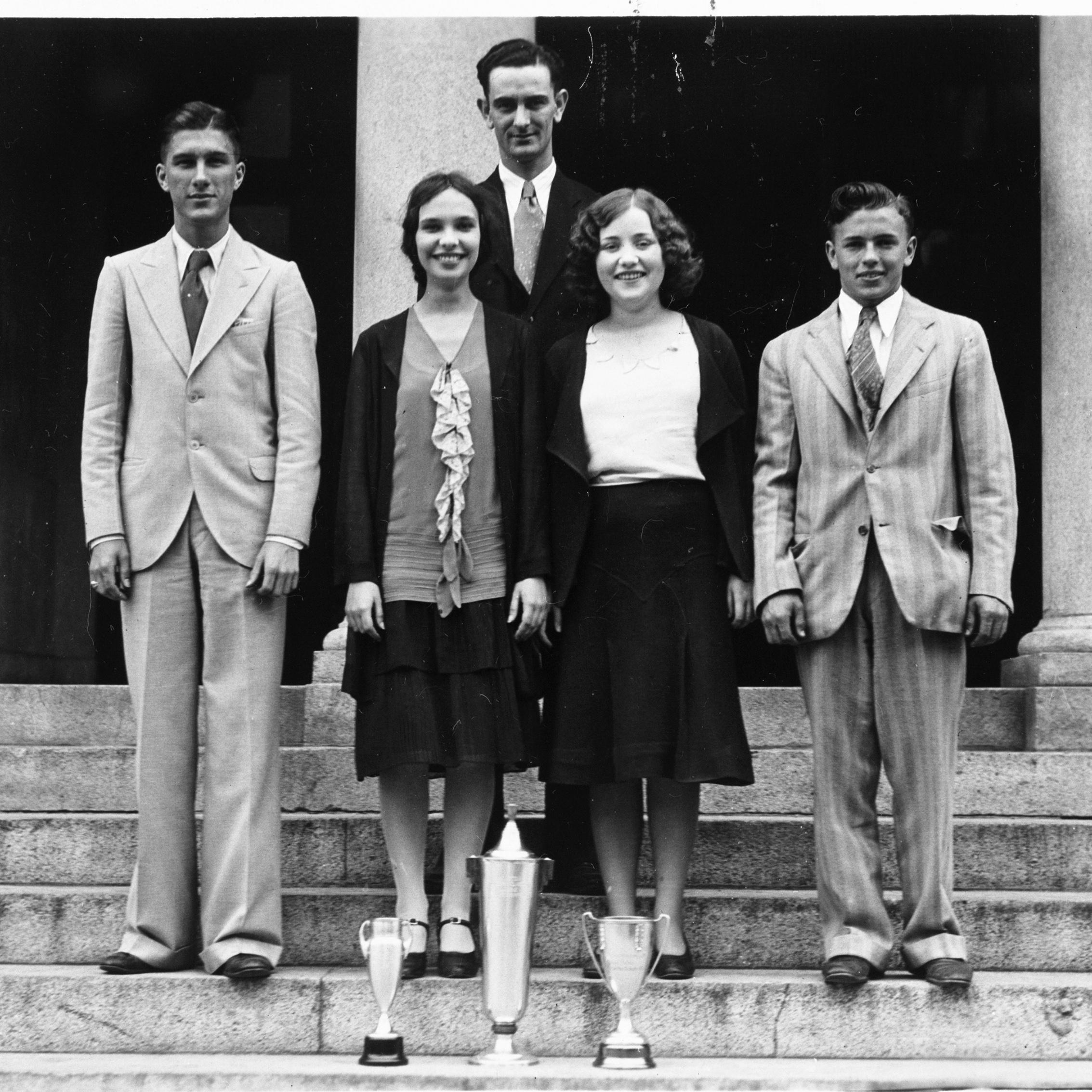 Lyndon B. Johnson, the debate coach at Sam Houston High School at the time, poses with his championship team--Luther Jones, Margaret Epley, Evelyn Lee, and Gene Lattimer.