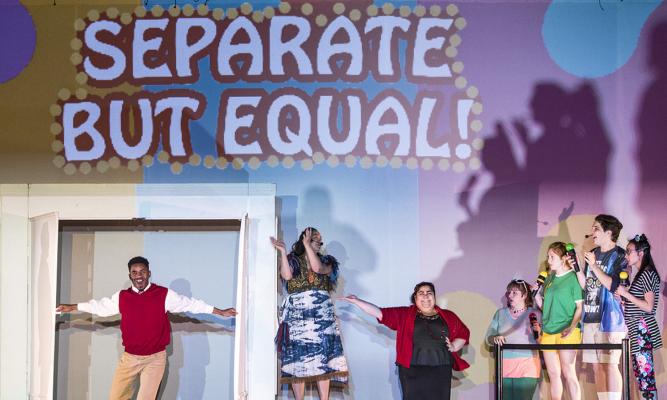 Performers onstage during a performance of Liberty! Equality! And Fireworks!