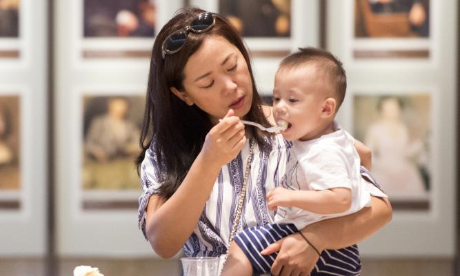 Yun Jeoung Song gives her son Alexander some LBJ birthday cake.