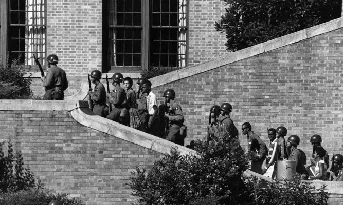 Operation Arkansas: A Different Kind of Deployment Photo by Courtesy of the National Archives September 20, 2007 Soldiers from the 101st Airborne Division escort the Little Rock Nine students into the all-white Central High School in Little Rock, Ark.