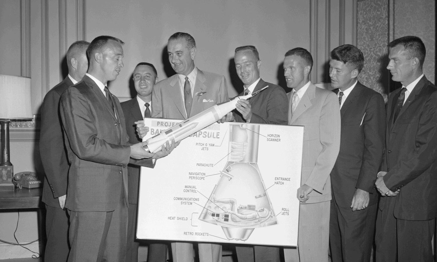 L-R: Alan Shepard, John Glenn (behind Shepard), Gus Grisson, Sen. LBJ Library photo by Lyndon B. Johnson, Scott Carpenter, Gordon Cooper, Walter Schirra, Deke Slayton. Frank Muto #59-5-3.3